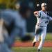 Eastern senior Brent Ohrman attempts to beat a Michigan State baserunner to first base as Eastern takes on Michigan State at Oestrike Stadium on Wednesday.  Melanie Maxwell I AnnArbor.com